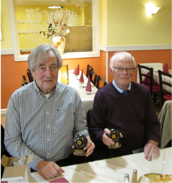 Club Champion Joe seems unsure, but Runner-up Robin is pleased.